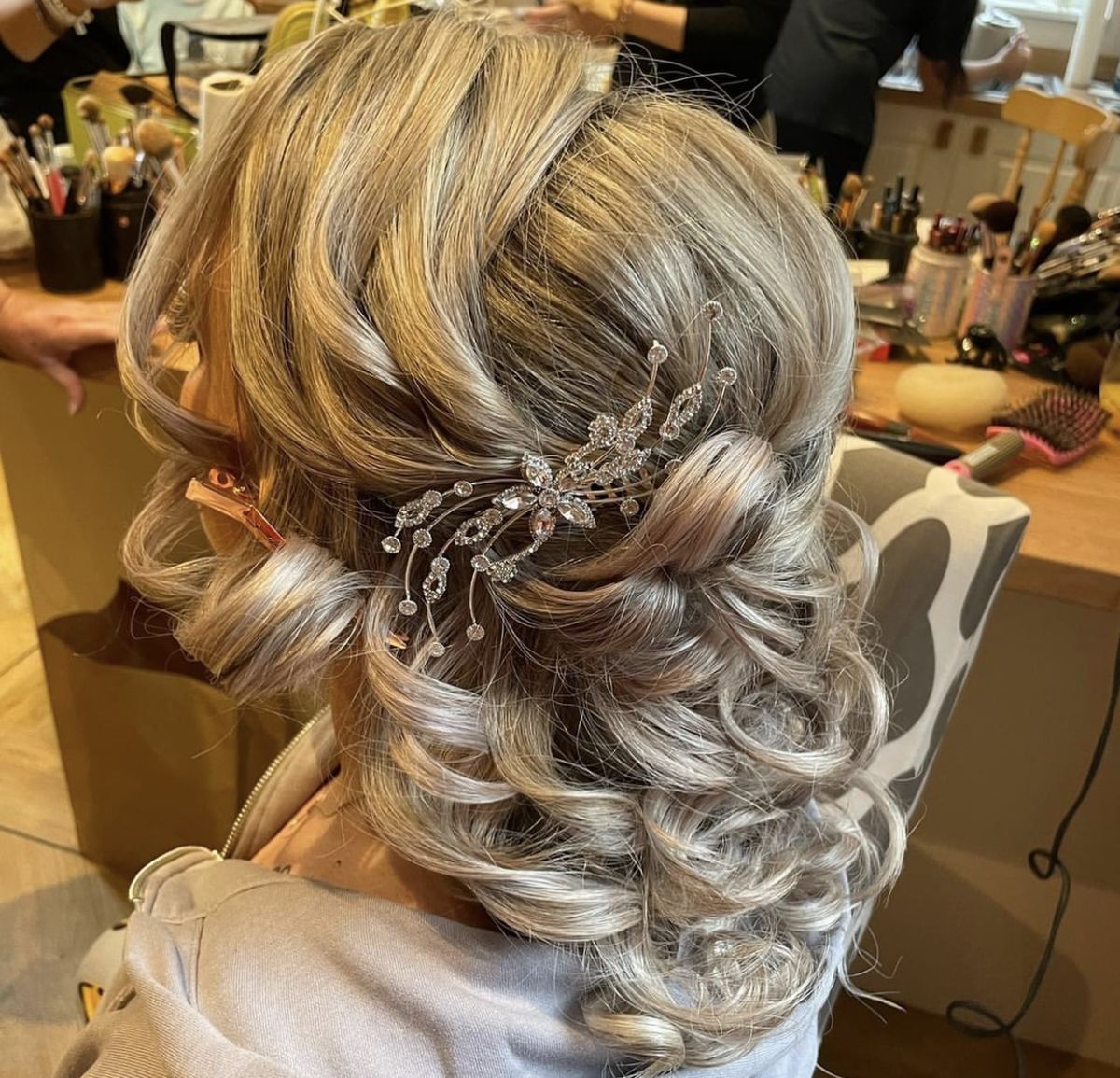 An occasion finish at Anthony B Salon, curls set with a jewelled clip
