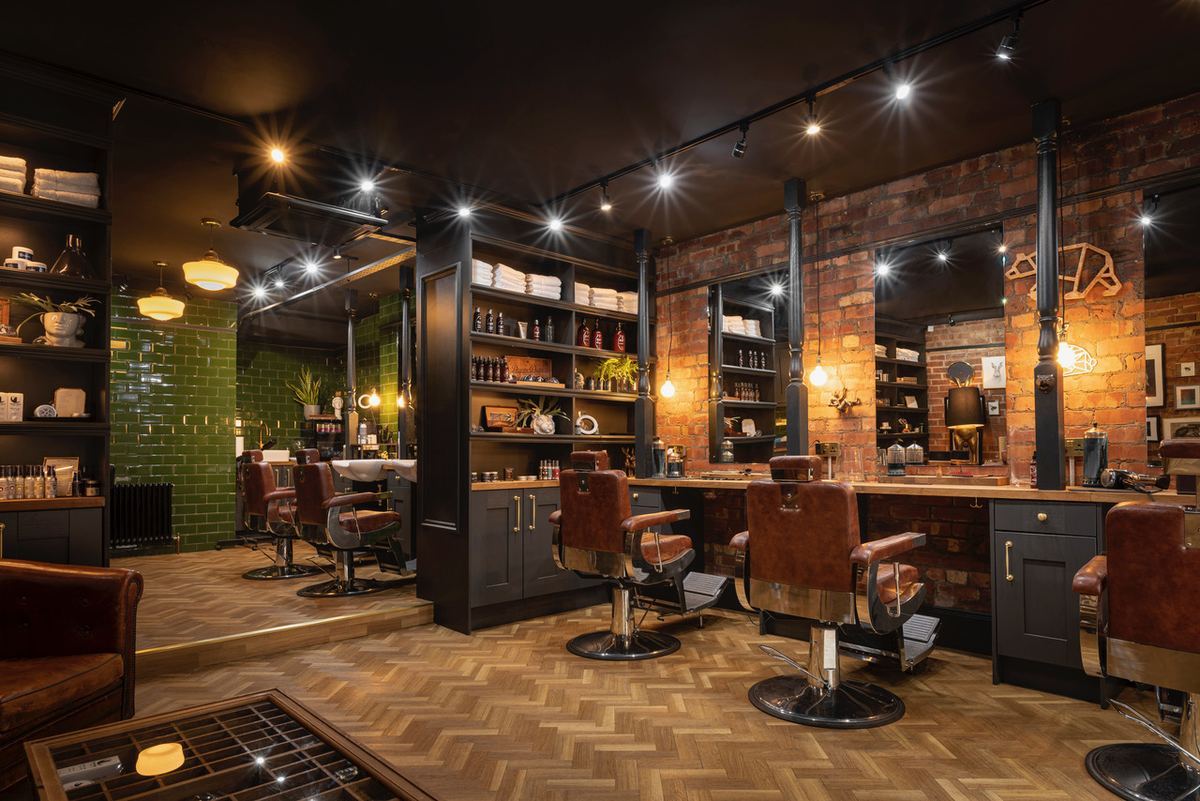 The full room at Bear and Hare Barbers, chairs, mirrors and product shelves