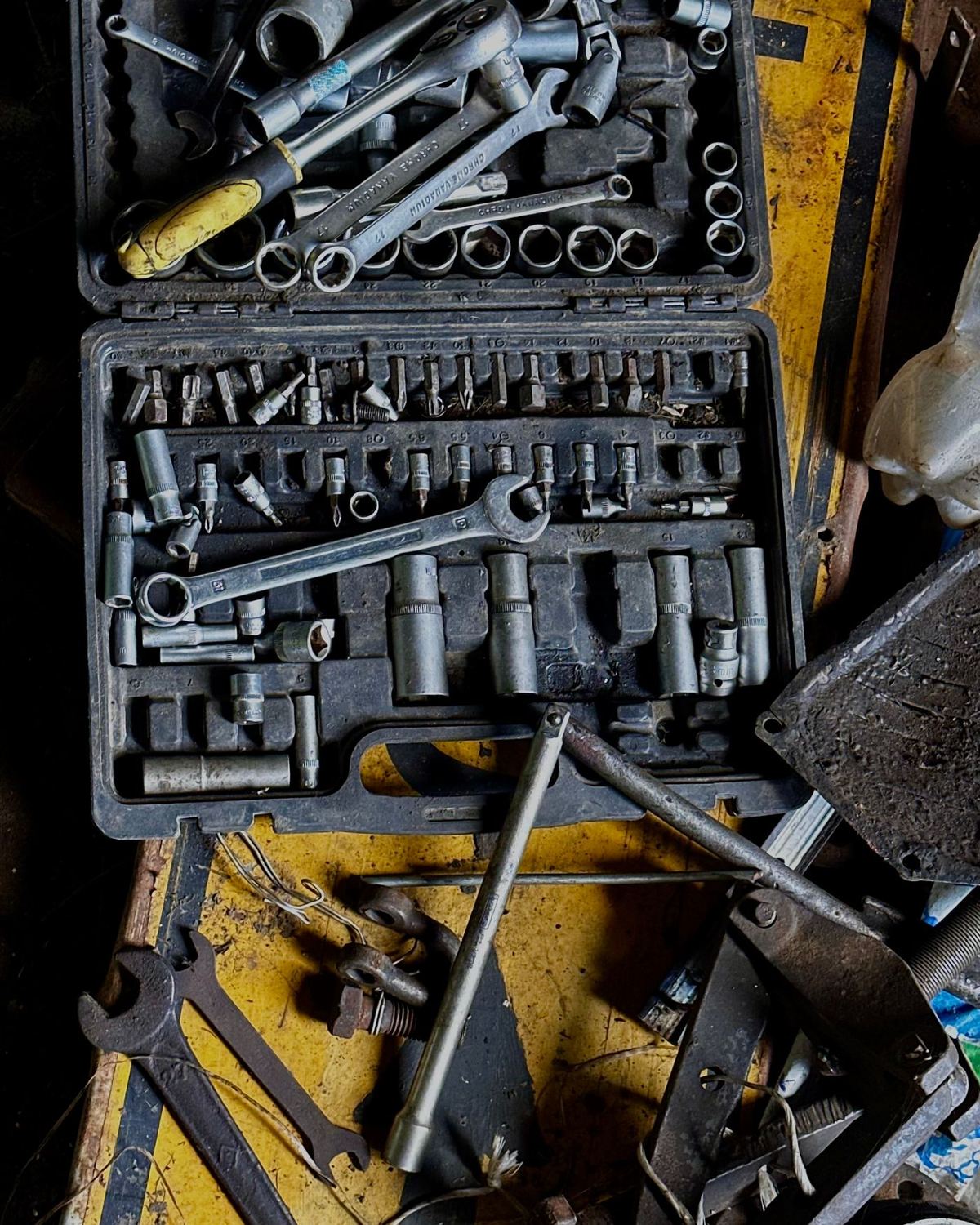 A socket set open on a workbench