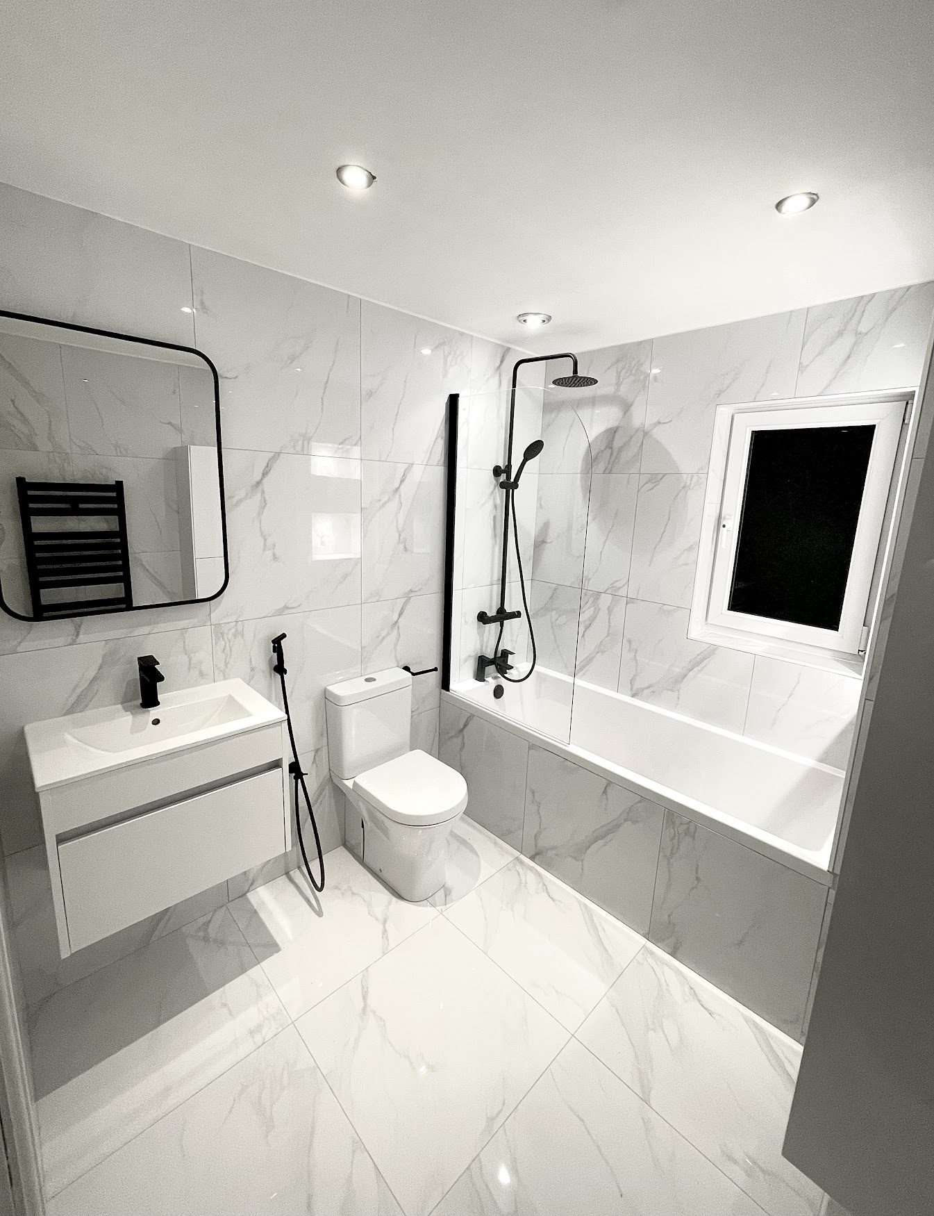 A marble bathroom fitted by DVSN Plumbing and Heating