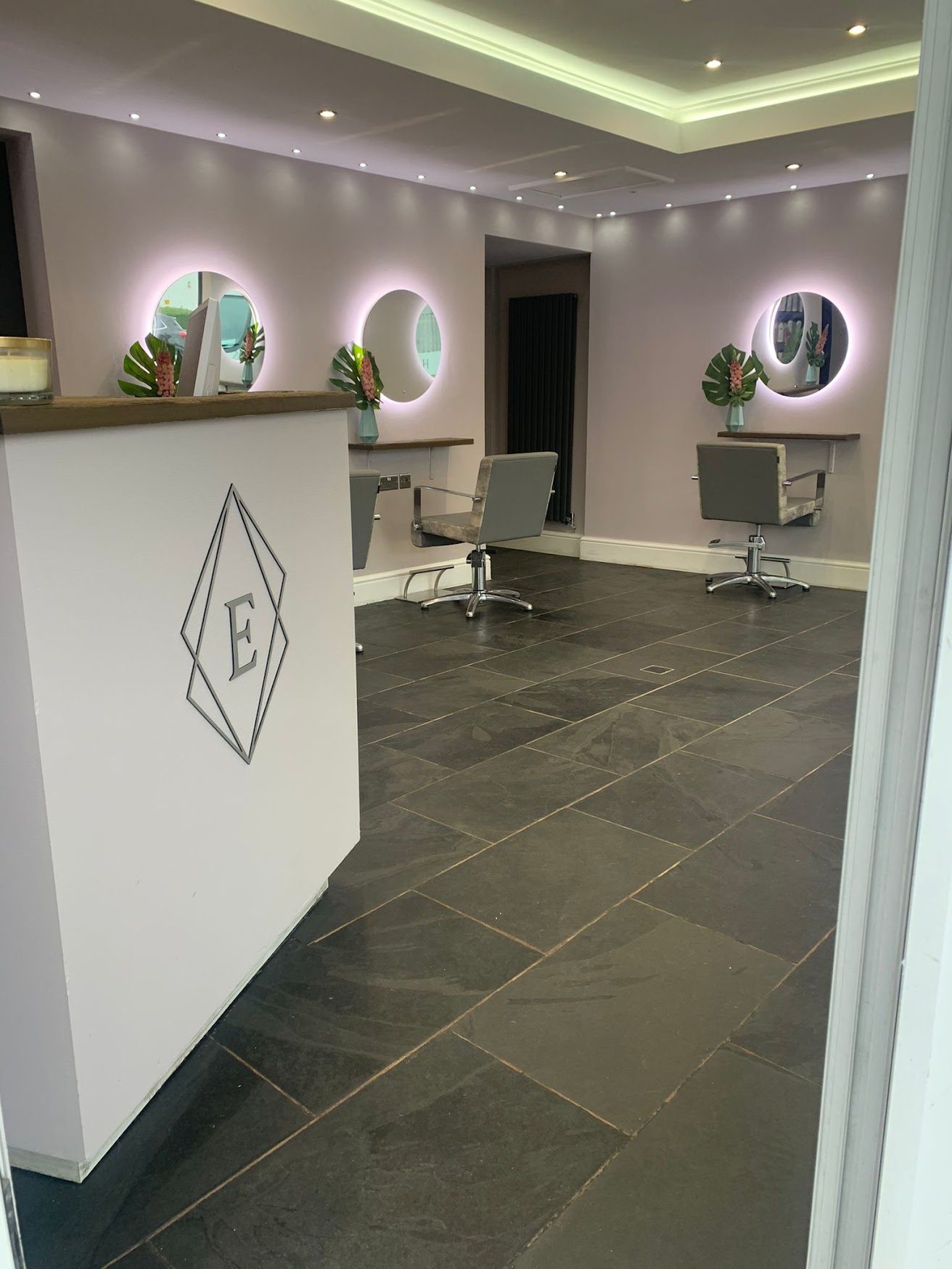 Reception desk with the Elysium logo
