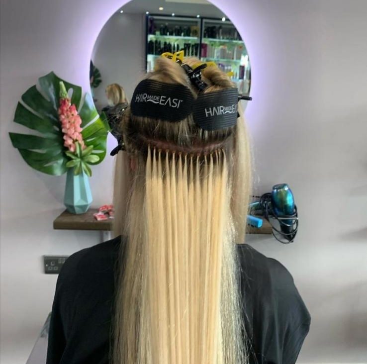Hair extensions being fitted