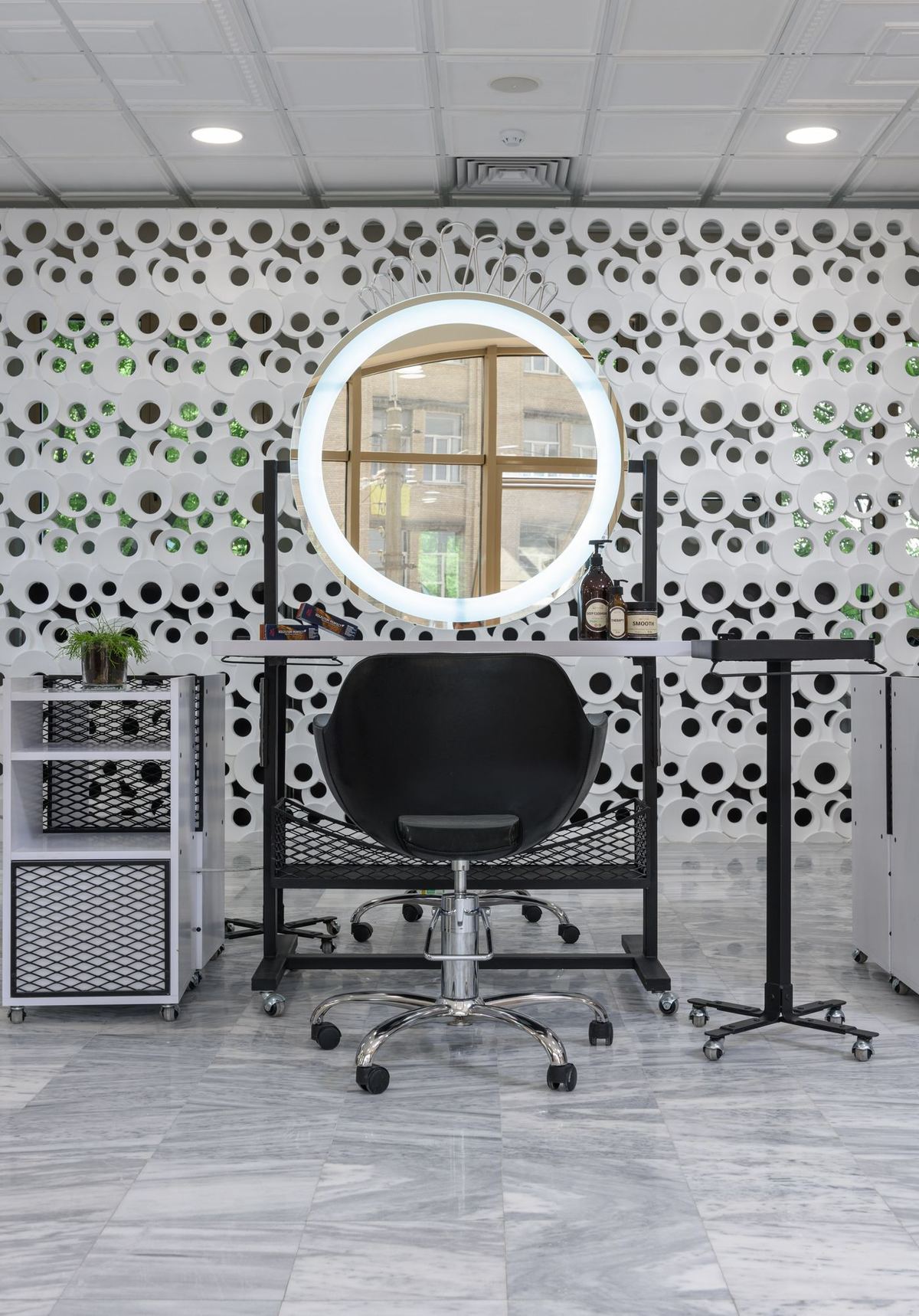A salon styling area with contemporary furniture