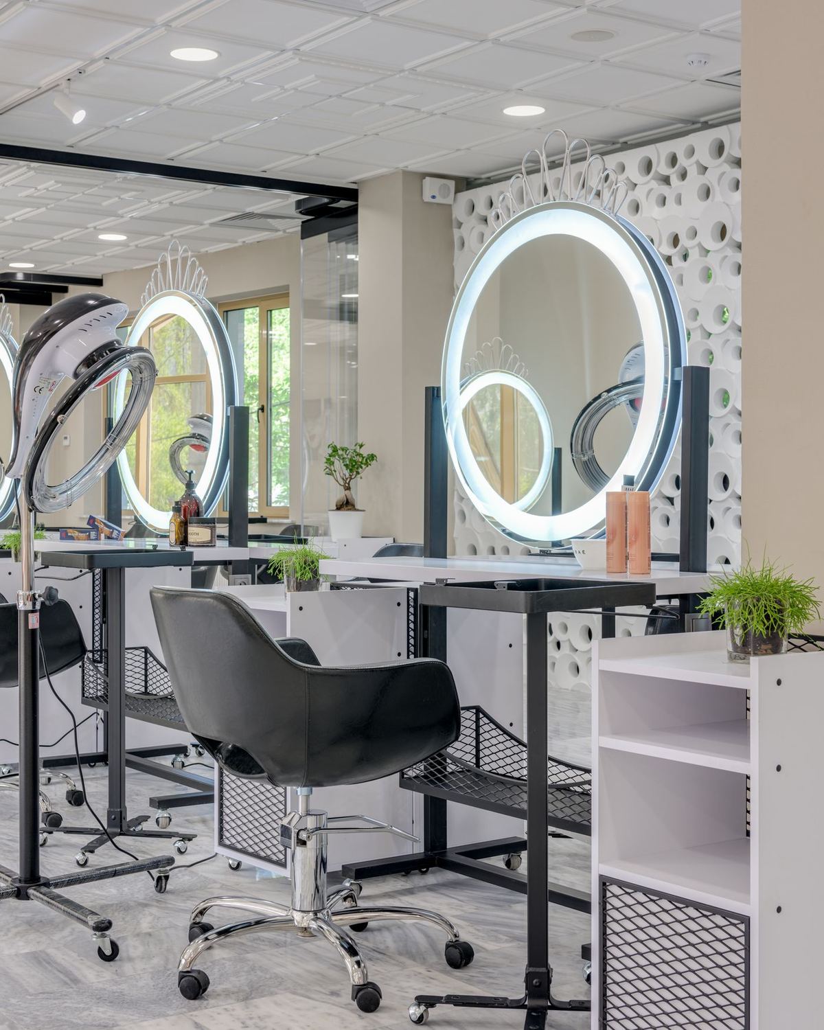 A styling station with a lit mirror
