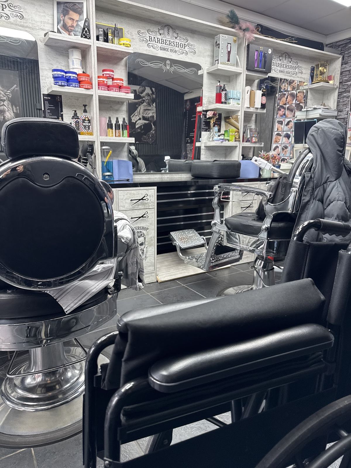 Inside Jian's Barbers, chairs and shelves