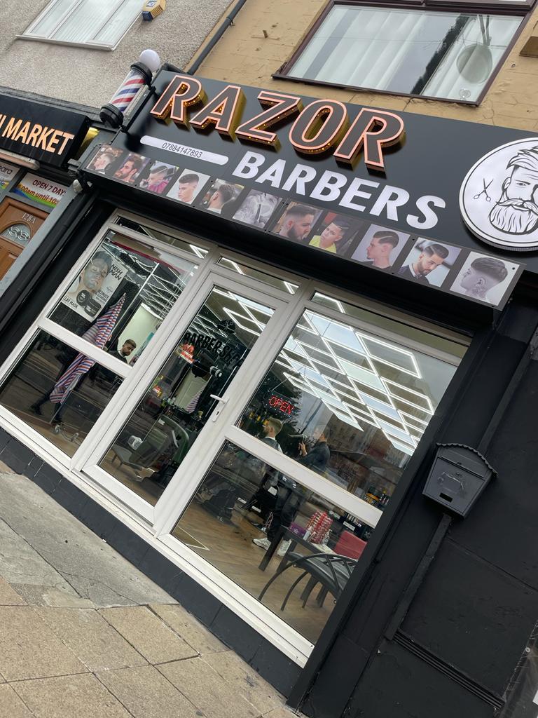 The RAZOR Barbers shopfront and barber pole