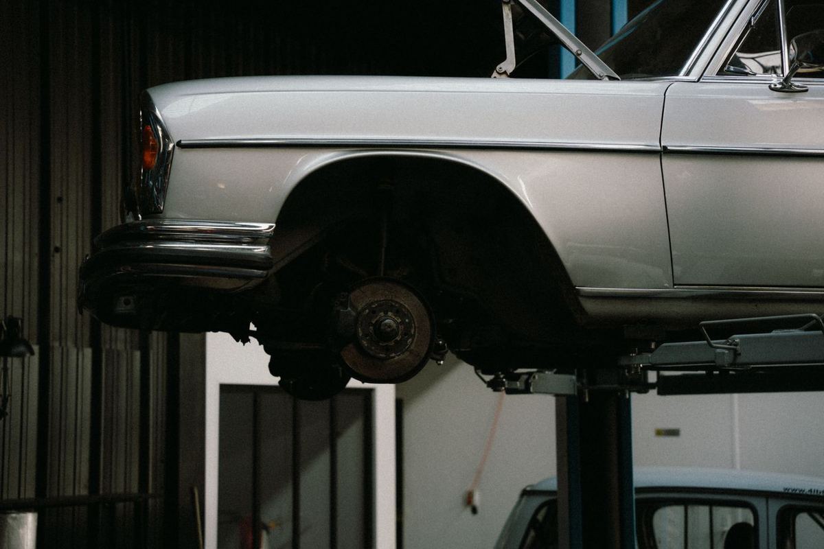 A car raised on a two-post lift