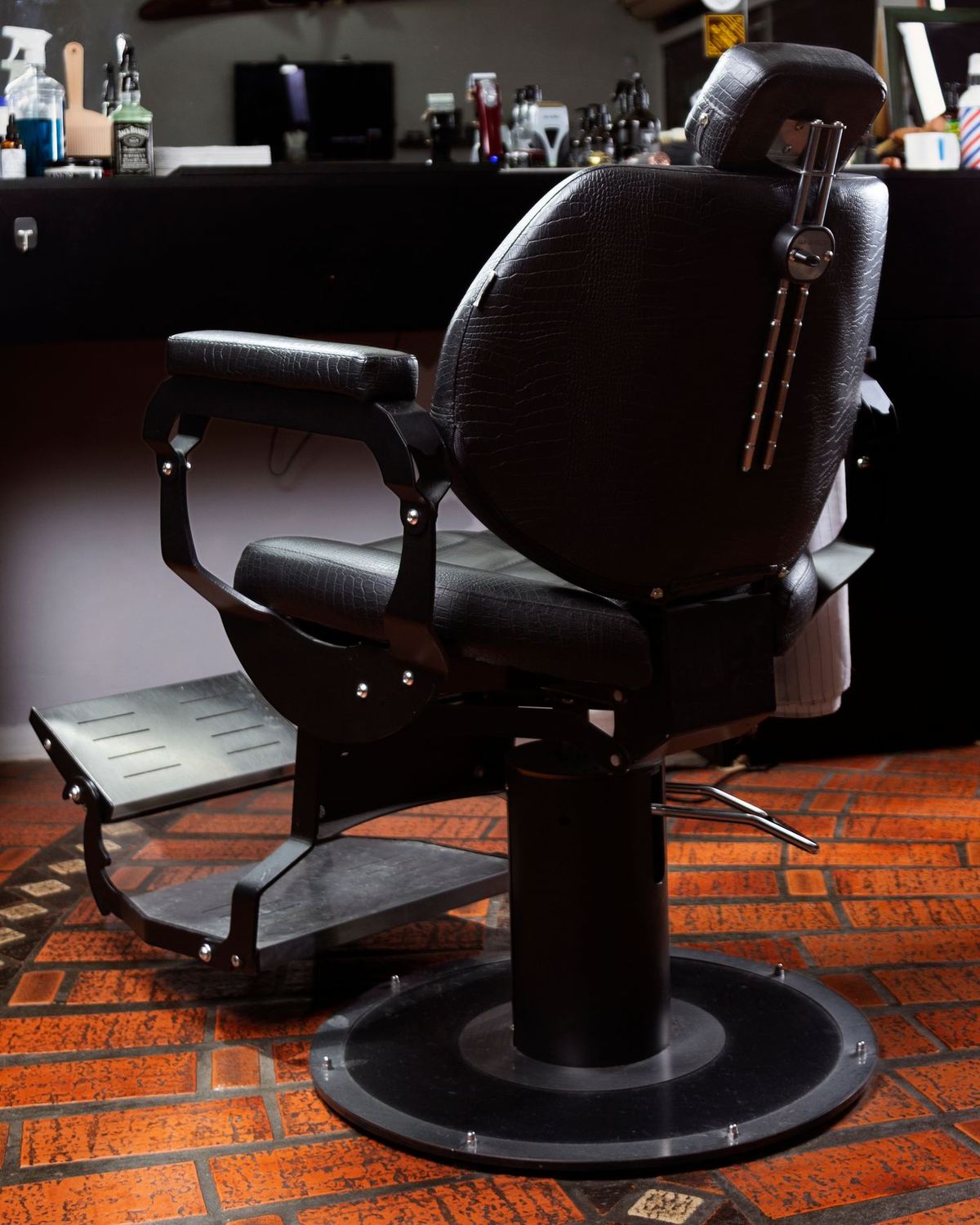 A traditional barber's chair and workstation